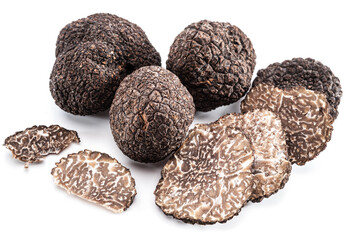 Black winter truffles and truffle slices on white background. The most famous of the trufflez.