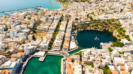 Agios Nikolaos. Agios Nikolaos is a picturesque town in the eastern part of the island Crete built...