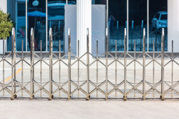 Folding retractable fence on casters.  barrier on casters. Sliding gates on rollers. Pedestrian barrier. Barricade Gate.  Chrome barrier on casters.