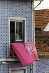 laundry on old facade building in Aveiro city in Portugal