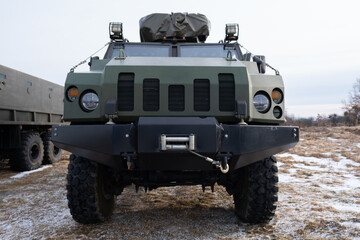 Obraz premium New armored personnel carrier armored car of the Ukrainian army. War in Ukraine. 2022