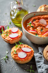 Traditional and delicious roll with red hummus as healthy breakfast.