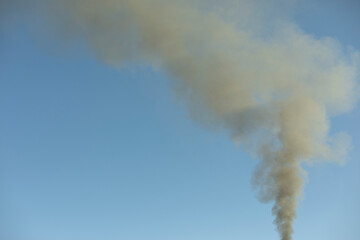 Smoke from chimney. Smoke in sky. Home heating.