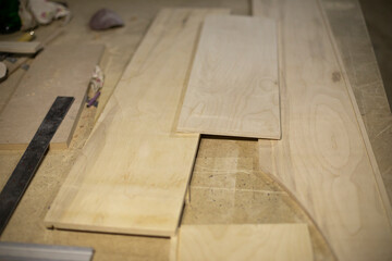 Boards on table. Joinery. Details of woodworking. Manufacture of furniture.