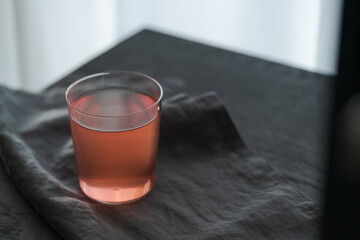 Berry lemonade in tumbler glass on linen cloth