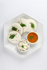 south indian food, IDLY WITH SAMBAR ,COCONUT CHUTNEY, served in a ceramic plate 