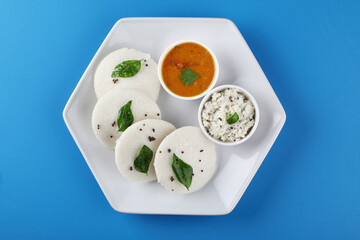south indian food, IDLY WITH SAMBAR ,COCONUT CHUTNEY, served in a ceramic plate 