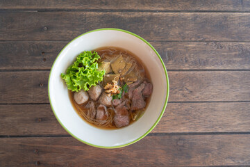 Beef noodles with braised beef, liver, and meatball are delicious food in Thailand. Chinese-style...