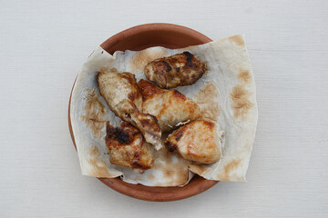 Grilled chicken on skewers (chicken shashlik). Popular dish of Georgian cuisine.