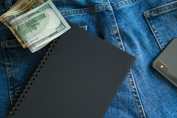 Business topics: money, notebook for records.