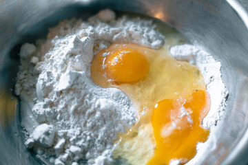 Raw eggs and flour. The dough preparation process