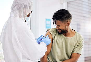 A jab is all it takes. Cropped shot of an unrecognizable doctor administering the covid 19 vaccine...
