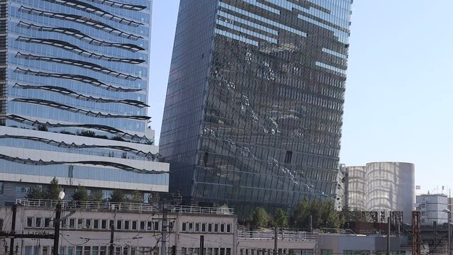 The Paris Ring Road (P&eacute;riph&eacute;rique) reflected in the Duo Towers, a new skyscraper in the south of Paris