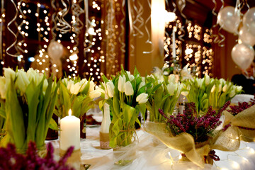 restaurant table setting ,tulips and candle