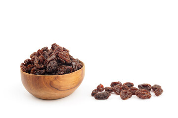 Organic dried Raisins in wooden bowls on white background, Currant