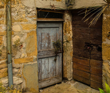 Old wooden doors in Poffabro, an historic medieval village in the Val Colvera valley in Pordenone province, Friuli-Venezia Giulia, north east Italy
