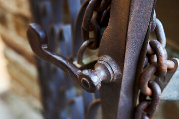 Rusty forged metal door handle, closeup