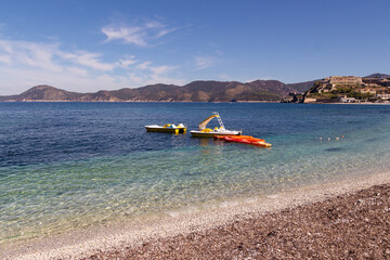 View from famous white vessel Padulella beach to city of Portoferraio, Island of Elba, Italy