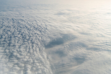 Aerial view on white fluffy clouds
