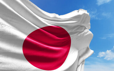 Japanese Flag is Waving Against Blue Sky with Clouds