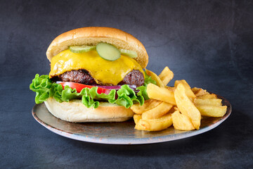 hamburger with french fries on chalkboard background