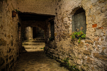 An alley in Poffabro, an historic medieval village in the Val Colvera valley in Pordenone province, Friuli-Venezia Giulia, north east Italy
