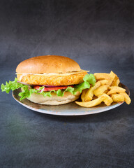 hamburger with french fries on chalkboard background