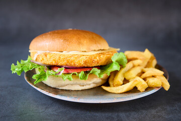 hamburger with french fries on chalkboard background