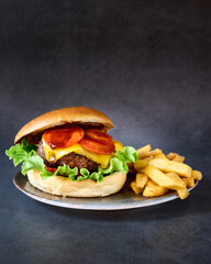 hamburger with french fries on chalkboard background