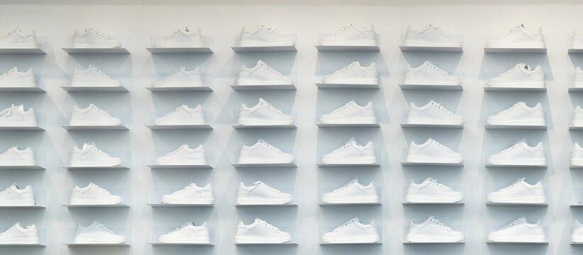 Store wall with white sneakers
