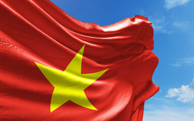 Vietnamese Flag is Waving Against Blue Sky with Clouds