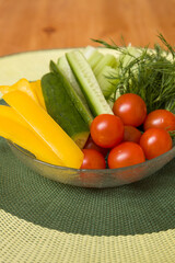 Fresh Organic Vegetables, Tomatoes, Cucumbers Yellow Pepper and Dill On Plate