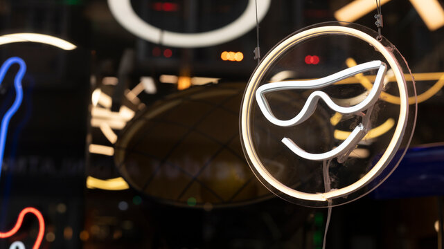 Emoji pattern crafted from neon lights. Technology and entertainment. - Powered by Adobe