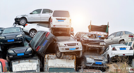 A pile of abandoned cars on junkyard