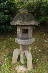 Fototapeta na wymiar Japanese concrete lantern in park 