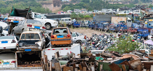 A pile of abandoned cars on junkyard