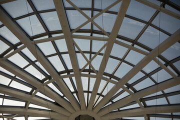 Dome roof made of glass and fittings. Steel beams form circle.