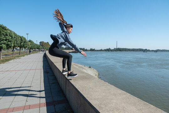 Young Woman Starting New Life After Car Crash Accident Or Heavy Illness With Morning Routine Of Exercising Running And Jogging Outdoor. Female Sport Person Stretching Muscles Before Workout.