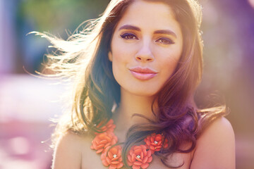 Beauty in the bright light of day. Portrait of an elegantly dressed gorgeous young woman outdoors.