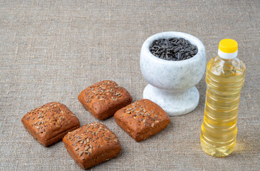 Sunflower oil, sunflower seed on the background of a sack.