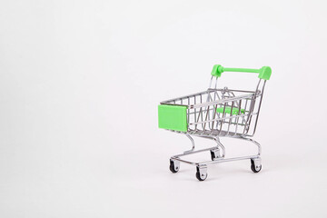 Empty shopping cart on wheels on a white background