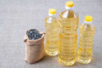Sunflower oil, sunflower seed on the background of a sack.