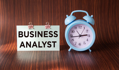 On the notepad text BUSINESS ANALYST. Concept of business, technology, internet and networks