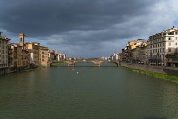 view of Arno river in Florence Italy and bridge on background 