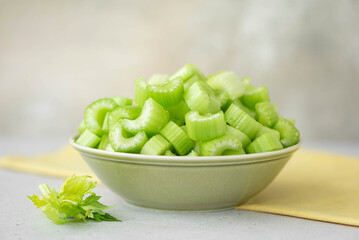 chopped celery stalks in a green plate