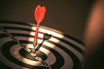Fototapeta premium Bullseye target goal or dartboard has dart arrow throw hitting center shooting for financial business targeting planning to winner concept.