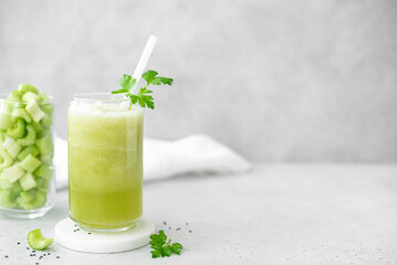 smoothie of celery cucumber and parsley in a tall glass