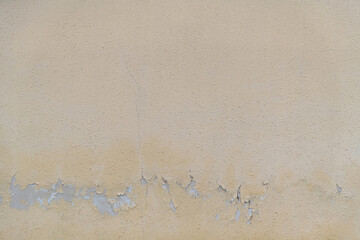 Yellow paint peeling off from wall