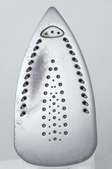 Damaged sole of the iron, brown stains and traces of burning with smoke and steam. Improper...