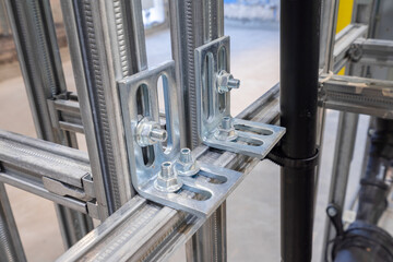 the process of plumbing installation. metal toilet seat mounts.